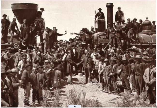 Union Pacific and Central Pacific locomotives meet at Promontory Summit, Utah, on May 10, 1869, as workers and officials celebrate completion of the first transcontinental railroad.